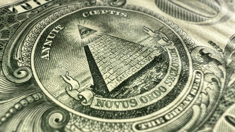 Крупный план долларовой купюры США, всевидящей пирамиды глаз
