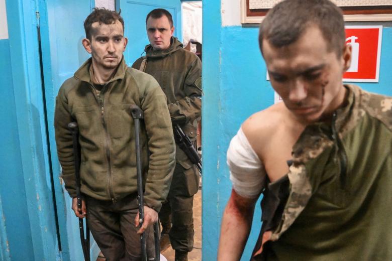 Военнослужащие Вооружённых сил Украины (на первом плане), сдавшиеся в плен в Мариуполе, в Новоазовской центральной районной больнице. Медики больницы оказали пленным медицинскую помощь