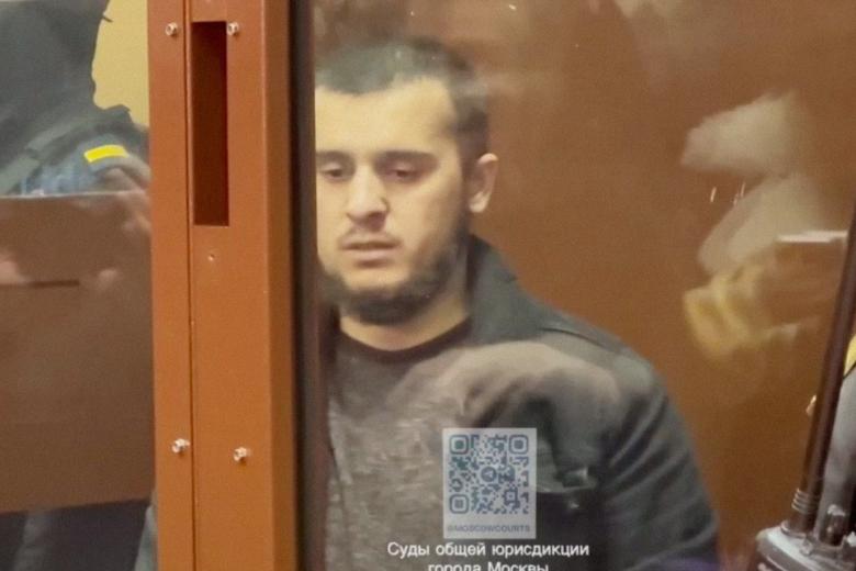 Диловар Исломов, задержанный по подозрению в террористическом акте в «Крокус Сити Холле», в здании Басманного суда Москвы